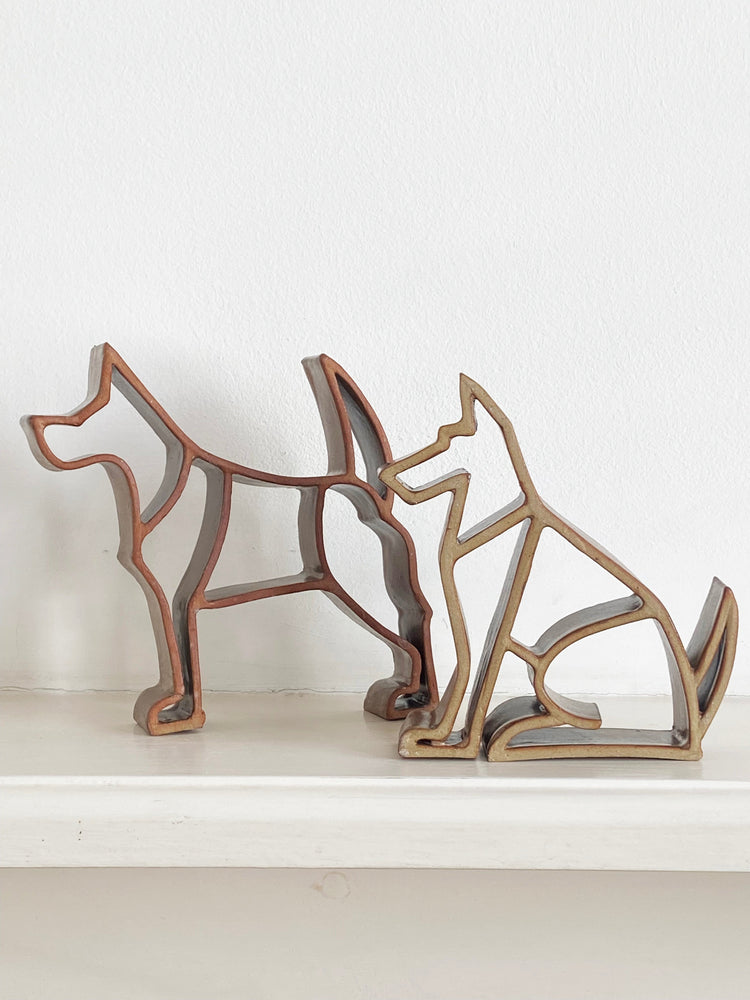 standing and sitting dogs